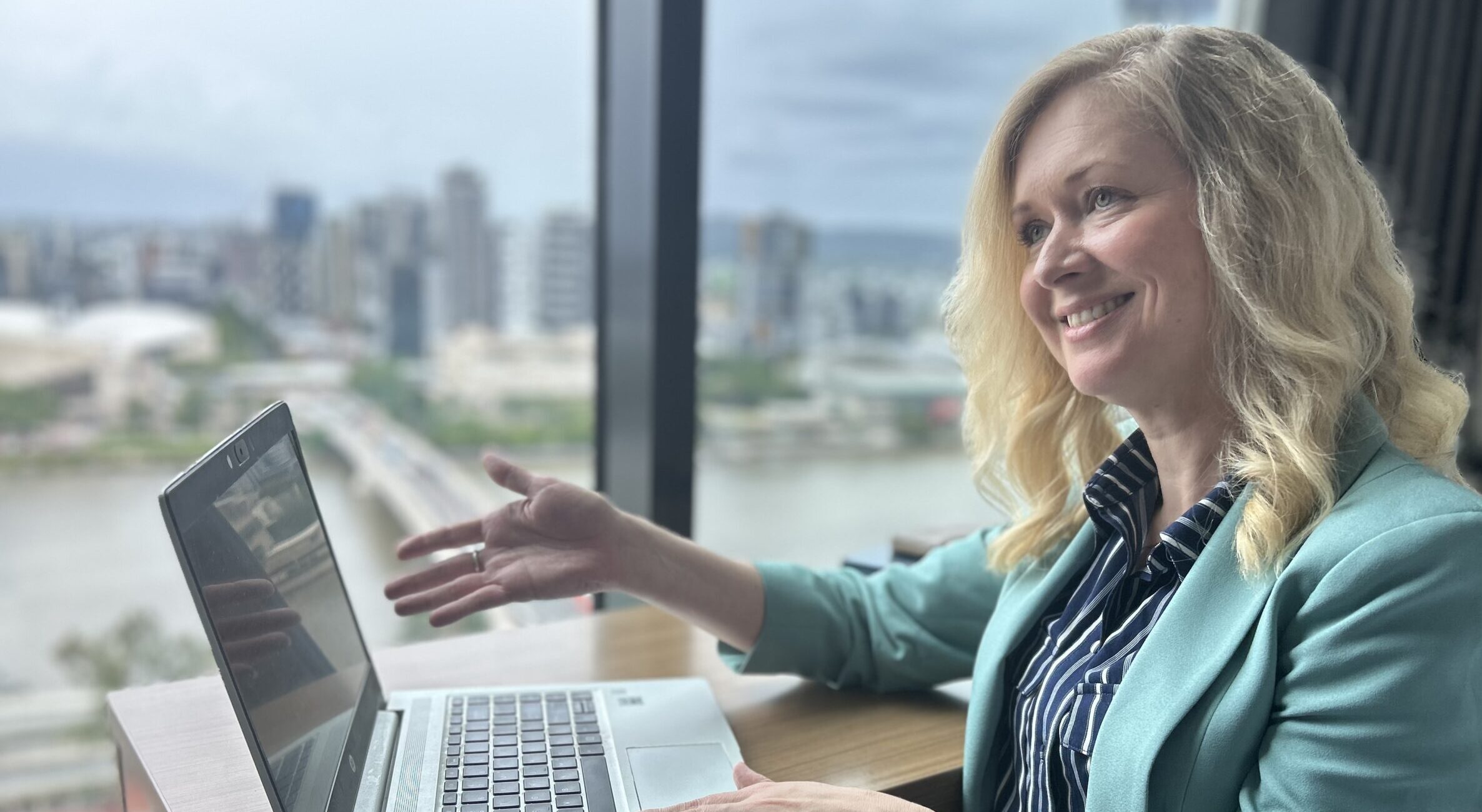 A CEO chairing a meeting of the management in her organisation